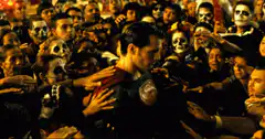 Superman surrounded by Day of the Dead crowd