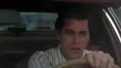 Ray Liotta driving with a cigarette