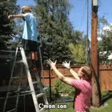 Guy on ladder falls, friend catches him