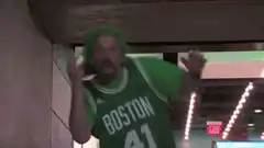 Man in Boston Celtics jersey dancing