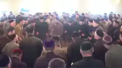 large group of men dancing in a circle