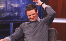 Jeremy Renner scratching his head
