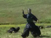 Man in black robe shooting energy blast