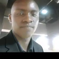 Man in suit with shiny forehead