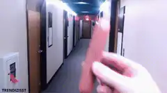 Hand throwing a hot dog down a hallway