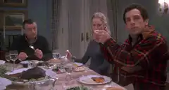 Ben Schwartz pointing at dinner table