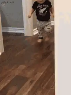 Toddler running in space shirt