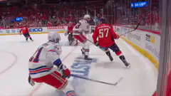Hockey player crashes into boards