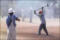Man hits baseball with axe