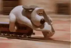 Gromit riding a train