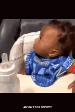 Baby crying and holding head