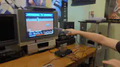 Man plays Wii Sports Baseball
