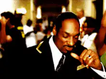 Snoop Dogg dancing in a suit