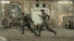 Soldiers running from a garage explosion
