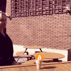 Woman eating ice cream with Bitcoin logo