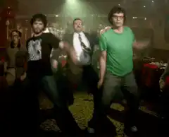 group of men dancing at a party