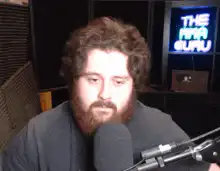 Jonah Hill talking into a microphone