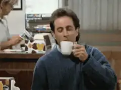 Jerry Seinfeld sips coffee and makes a face