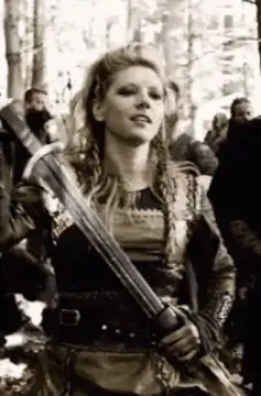 Astrid sheathes her sword