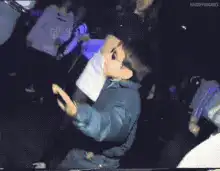 Kid in sunglasses dancing at a party