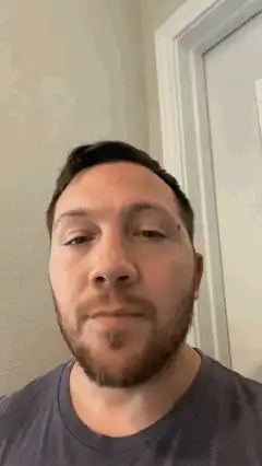 Man looks up with a blank stare