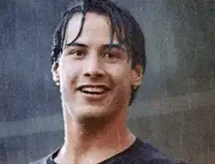 Keanu Reeves smiling and giving a thumbs up