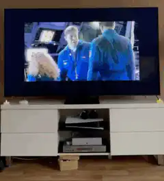 TV screen scene with two men in blue uniforms