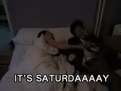 Excited couple jumping in bed