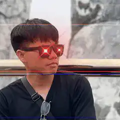 Man with glowing red eyes