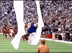 John Travolta dances on football field