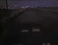 Car driving under Anywhere sign