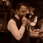 Man praying in a bar