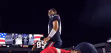 Tom Brady walking through fireworks