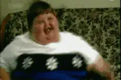 Boy laughing on couch