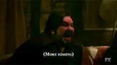 Vampire hissing in a bar