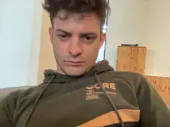 Man in green hoodie looking down