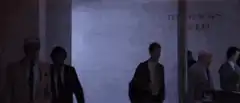 People walking through a hallway