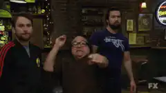 Pete Holt holds up five fingers at dartboard