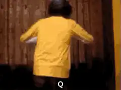 Person in yellow shirt opening curtains