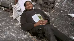 Man sleeping with book on chest
