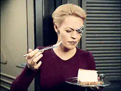 Catherine Zeta-Jones eating cake with eye makeup