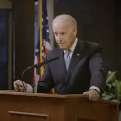 Joe Biden looking down at podium