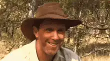 Man in hat gives thumbs up