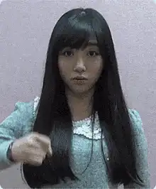 Girl pointing finger and smiling