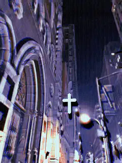 glowing cross over city street