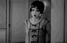 Louise Brooks shushing the camera