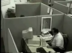 Man throws computer monitor in office