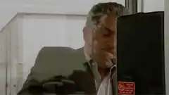 George Clooney looking through glass