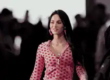 Megan Fox smiling and looking around