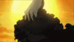 Hand emerging from dark mass at sunset